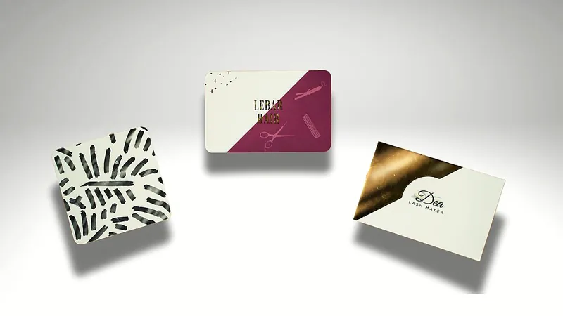 Trois cartes de visite à dorure et motifs graphiques